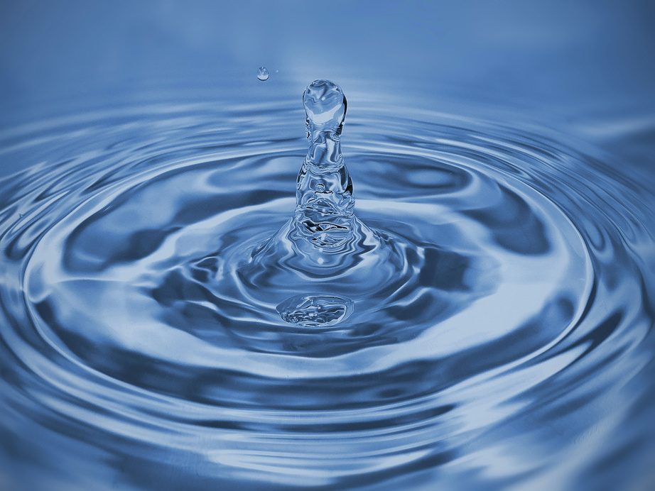 A droplet falling into clear water